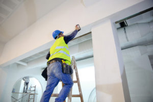IWM-Aktuell iStock-521709428-300x200 Plaster applying plaster on a new drywall installation.  