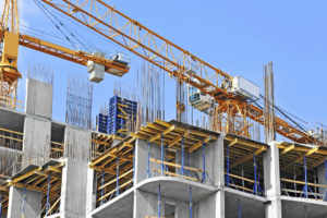 IWM-Aktuell iStock_000045207816_Large-300x200 Crane and building construction site against blue sky  